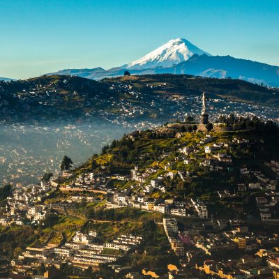 View of El Panecillo in the center of Quito with the Cotopaxi in the background