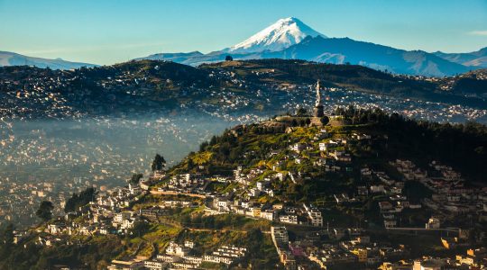 View of El Panecillo in the center of Quito with the Cotopaxi in the background
